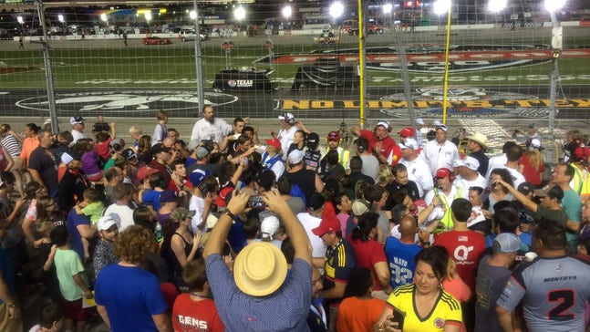IndyCar drivers go into stands to sign autographs during rain delay